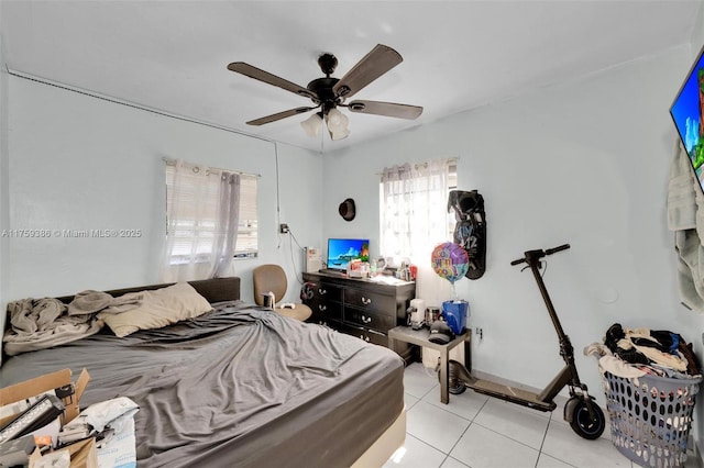 bedroom with light tile patterned flooring and a ceiling fan