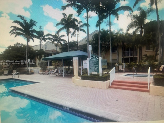 community pool featuring a patio area