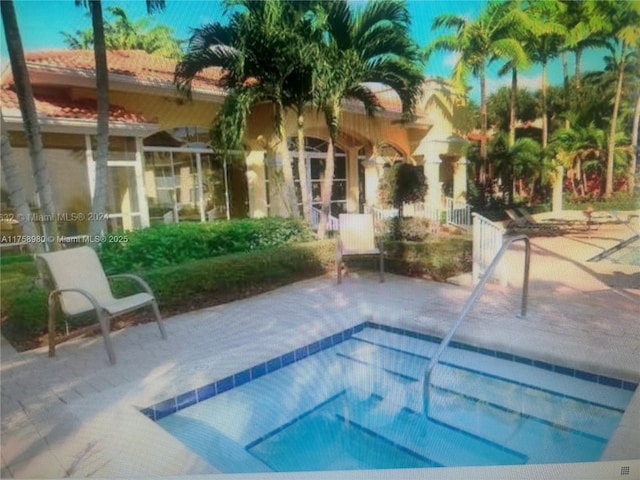 view of pool featuring a patio area