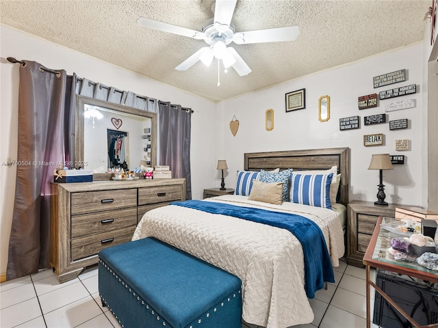 bedroom featuring light tile patterned flooring, a textured ceiling, and a ceiling fan