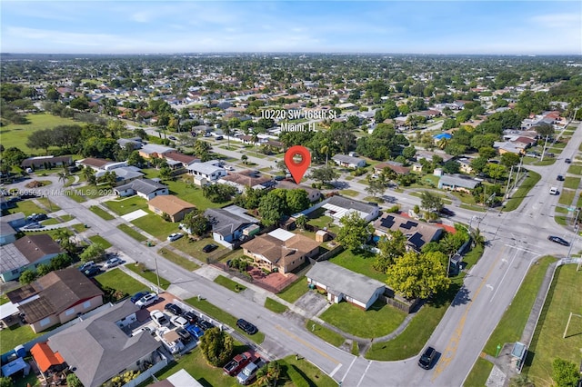 birds eye view of property with a residential view