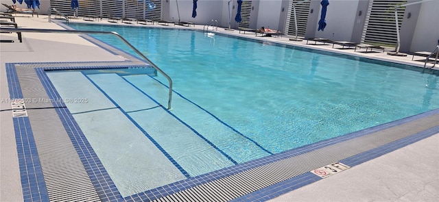 pool with a patio area