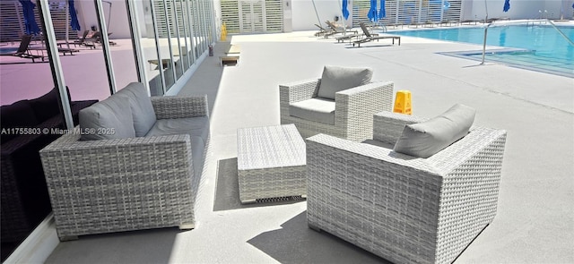 view of patio featuring an outdoor hangout area and a community pool