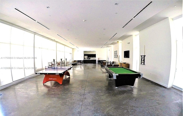 rec room with baseboards, finished concrete floors, and billiards