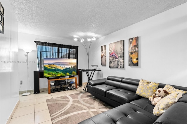 living area with baseboards, a textured ceiling, and tile patterned flooring