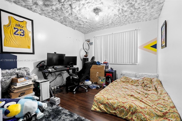 bedroom featuring wood finished floors