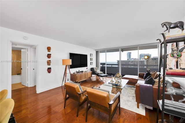 living room featuring baseboards and wood finished floors