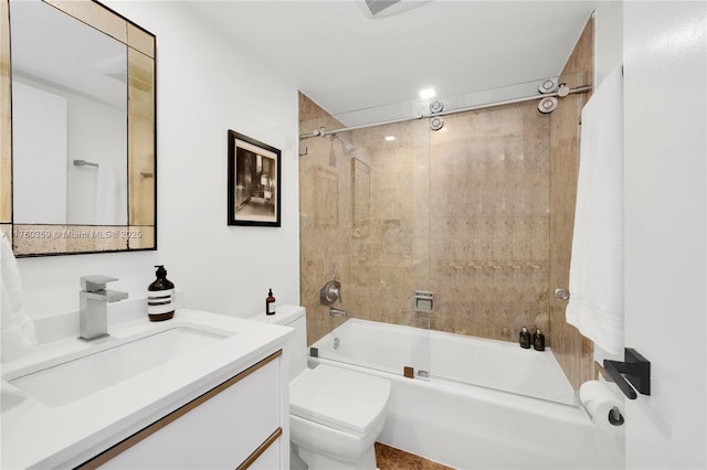 full bath featuring toilet, vanity, and shower / tub combination