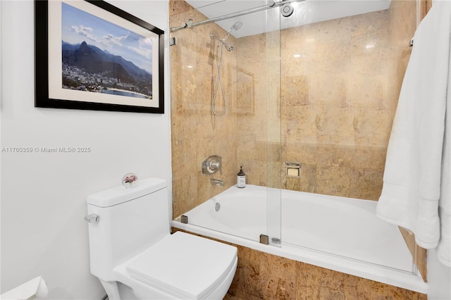 bathroom with toilet and washtub / shower combination