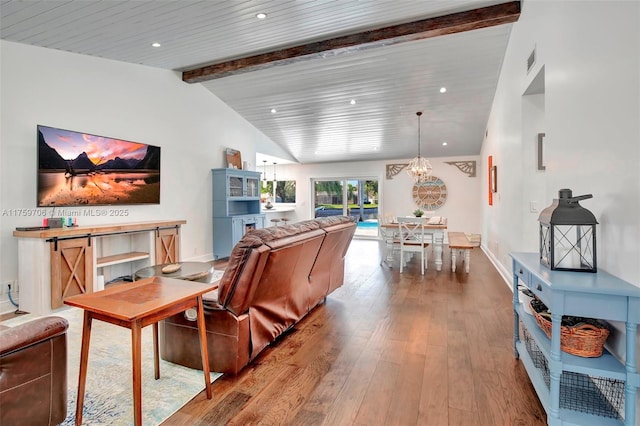 interior space featuring visible vents, vaulted ceiling with beams, baseboards, hardwood / wood-style floors, and recessed lighting