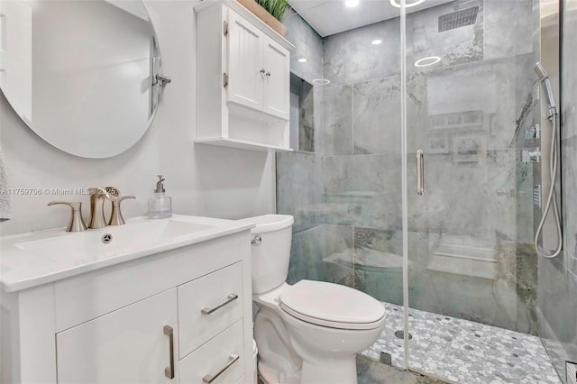 full bath with a shower stall, toilet, and vanity