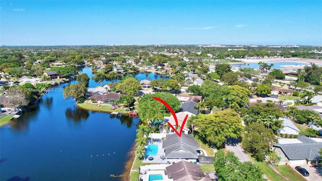 birds eye view of property with a residential view and a water view