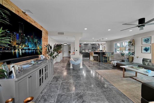 living room featuring a ceiling fan, recessed lighting, and visible vents