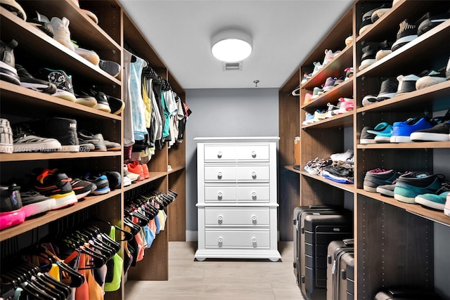 walk in closet with visible vents