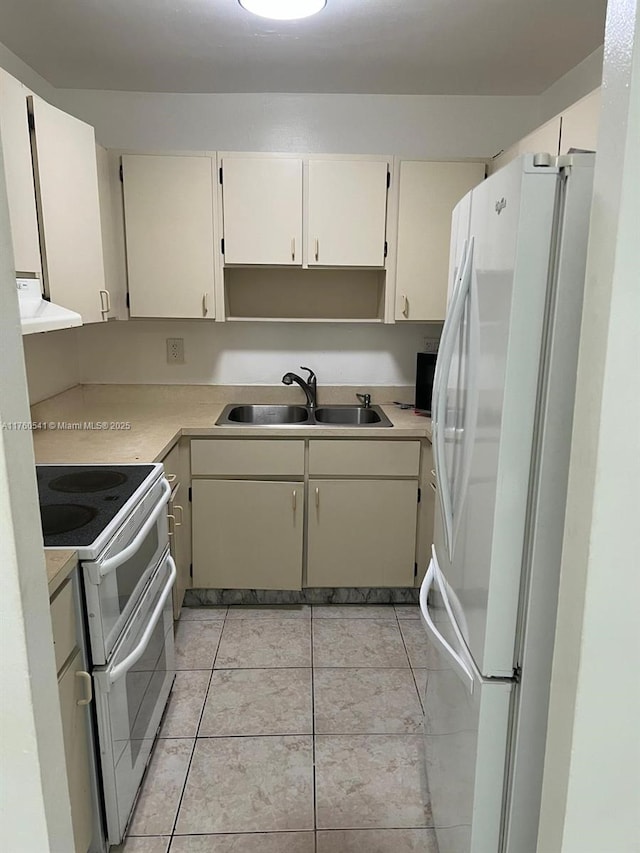 kitchen featuring white appliances, light tile patterned floors, a sink, light countertops, and exhaust hood