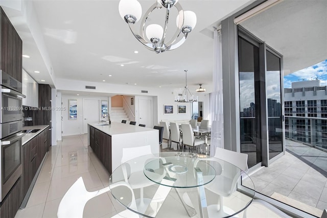 dining space with visible vents, stairs, light tile patterned floors, recessed lighting, and a notable chandelier