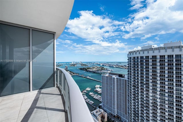 balcony featuring a water view