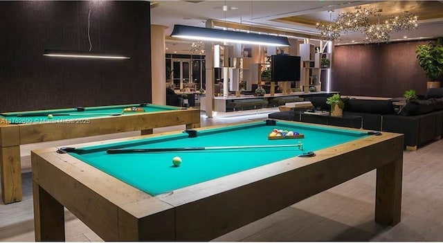 rec room with pool table and a raised ceiling