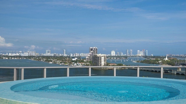 view of pool with a view of city