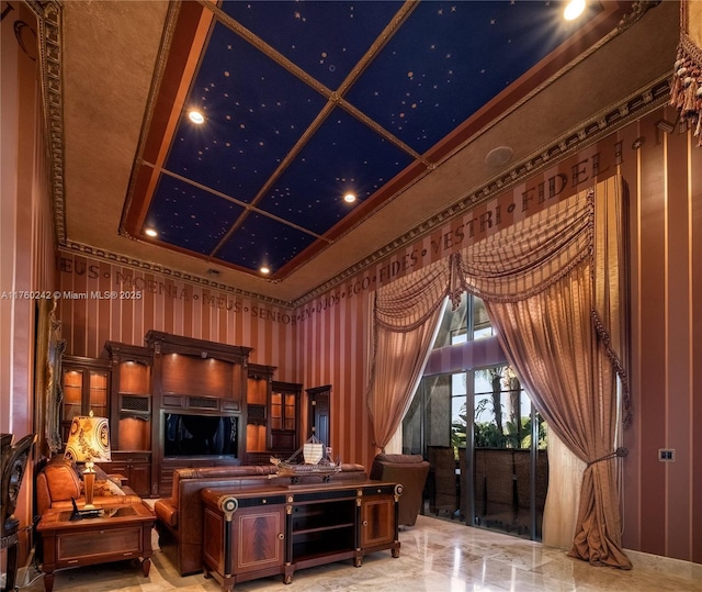 living area with coffered ceiling