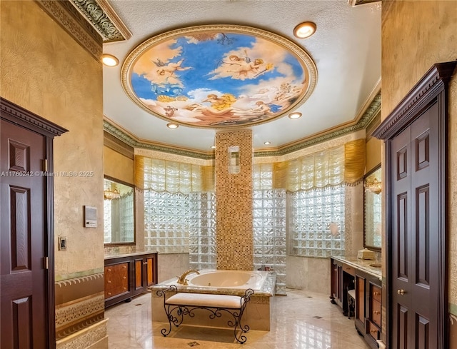 bathroom featuring recessed lighting, a jetted tub, ornamental molding, and vanity