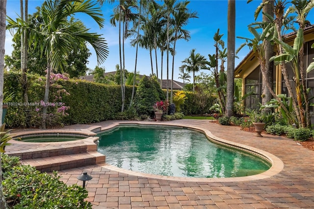 view of swimming pool featuring a pool with connected hot tub