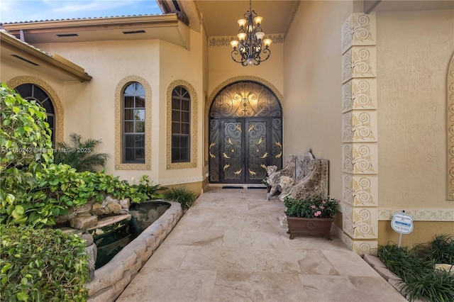 doorway to property with stucco siding