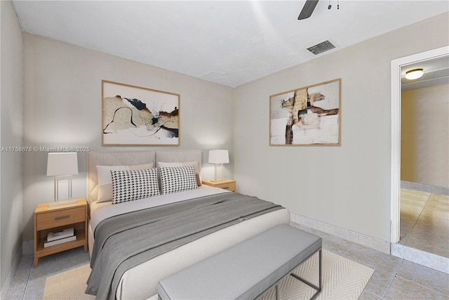 bedroom with visible vents, baseboards, and a ceiling fan