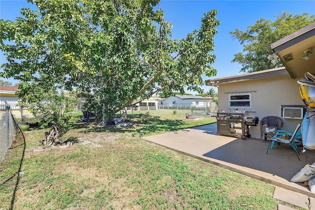 view of yard with a patio area and a fenced backyard