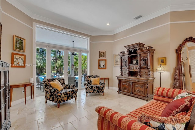 living area featuring stone tile flooring, french doors, crown molding, and baseboards