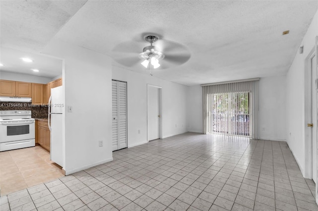 unfurnished living room with baseboards, a textured ceiling, and a ceiling fan