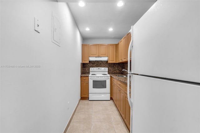 kitchen with white appliances, light tile patterned floors, recessed lighting, under cabinet range hood, and backsplash