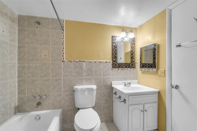 full bathroom featuring vanity, toilet, and tile walls