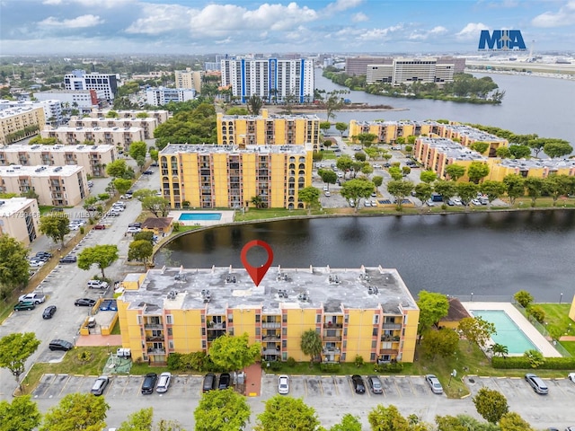 aerial view featuring a city view and a water view