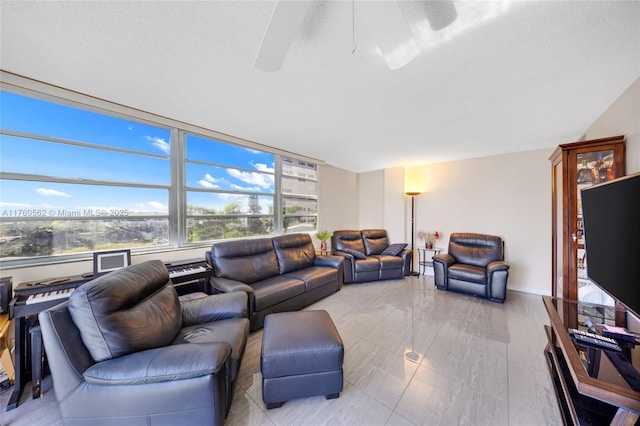 3113 S Ocean Dr Unit 506, Hallandale Beach, FL 33009 - living area featuring a ceiling fan and a textured ceiling