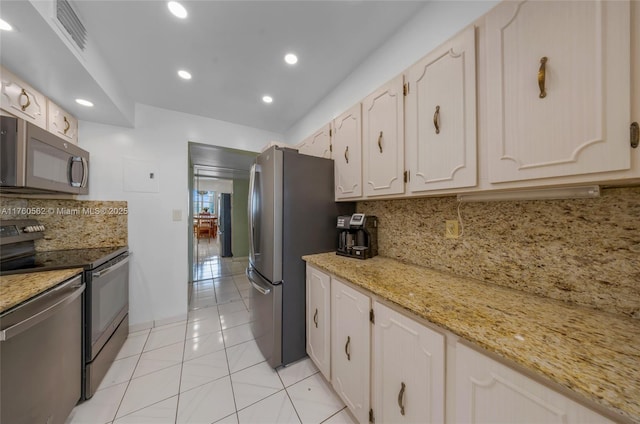 3113 S Ocean Dr Unit 506, Hallandale Beach, FL 33009 - kitchen featuring visible vents, backsplash, recessed lighting, stainless steel appliances, and light tile patterned floors