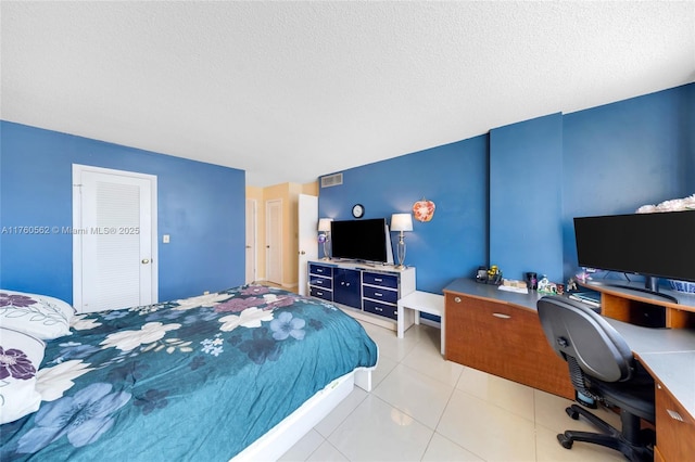 3113 S Ocean Dr Unit 506, Hallandale Beach, FL 33009 - bedroom featuring light tile patterned floors, visible vents, and a textured ceiling