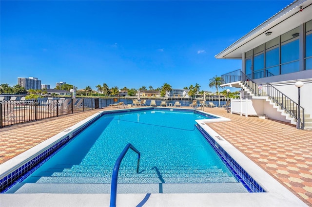 3113 S Ocean Dr Unit 506, Hallandale Beach, FL 33009 - pool with stairs, a patio, and fence