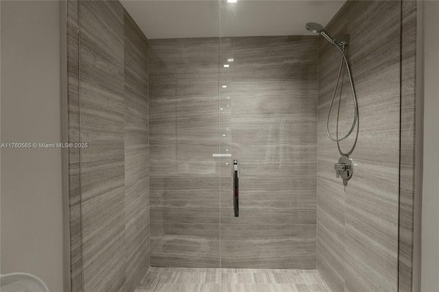 bathroom with a shower stall