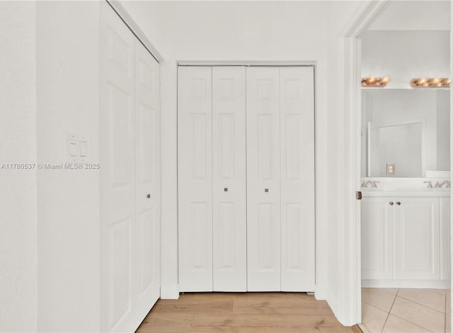 unfurnished bedroom with light wood-style flooring