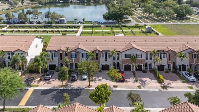 birds eye view of property featuring a water view and a residential view