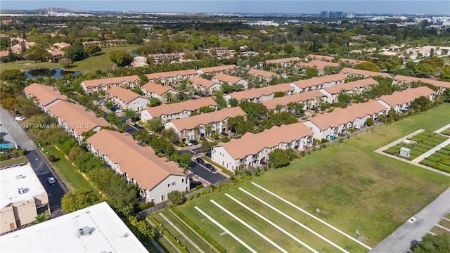 aerial view featuring a residential view and a water view