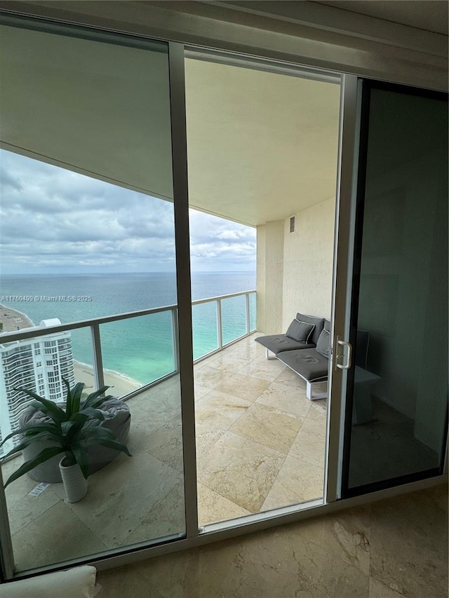 balcony featuring a water view