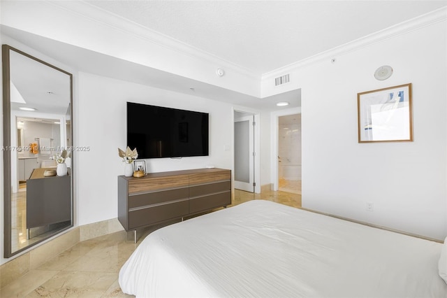 bedroom featuring ornamental molding, visible vents, baseboards, and ensuite bathroom