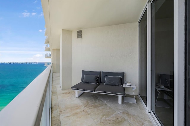 balcony with visible vents and a water view