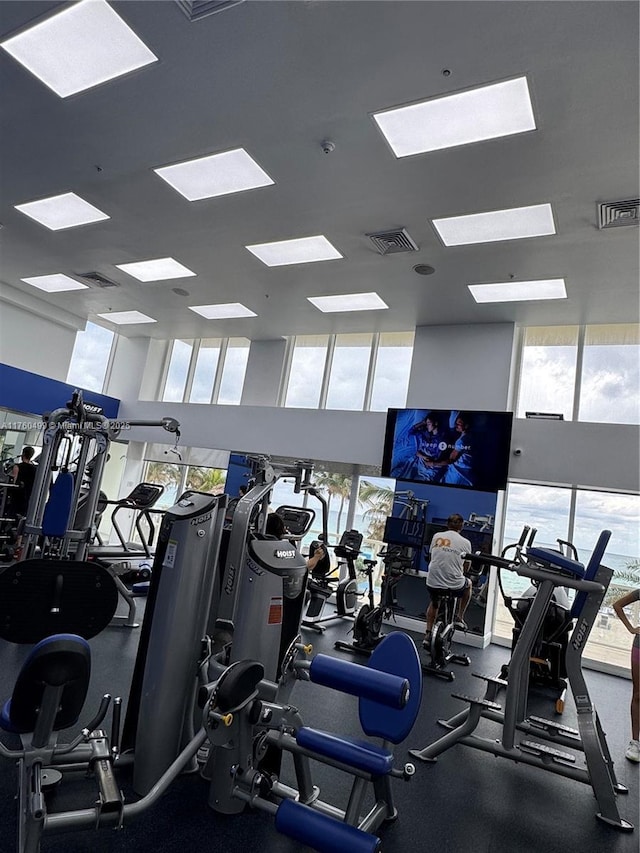 exercise room with visible vents and expansive windows