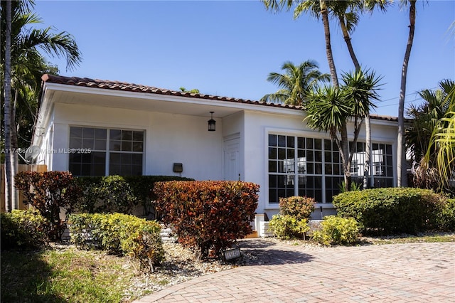 mediterranean / spanish-style home featuring stucco siding