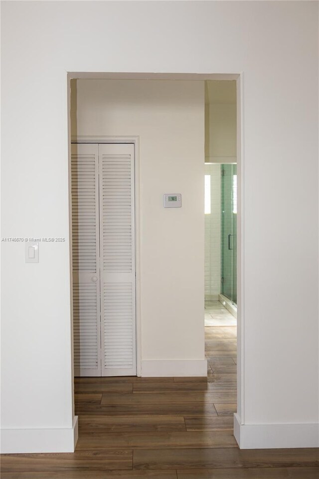 8926 Dickens Ave, Surfside, FL 33154 - hall with wood finished floors and baseboards