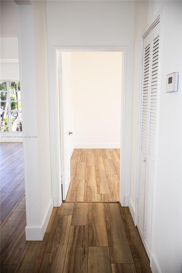 8926 Dickens Ave, Surfside, FL 33154 - corridor with wood finished floors and baseboards