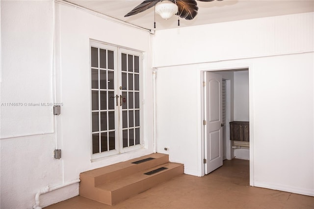 spare room featuring french doors and ceiling fan